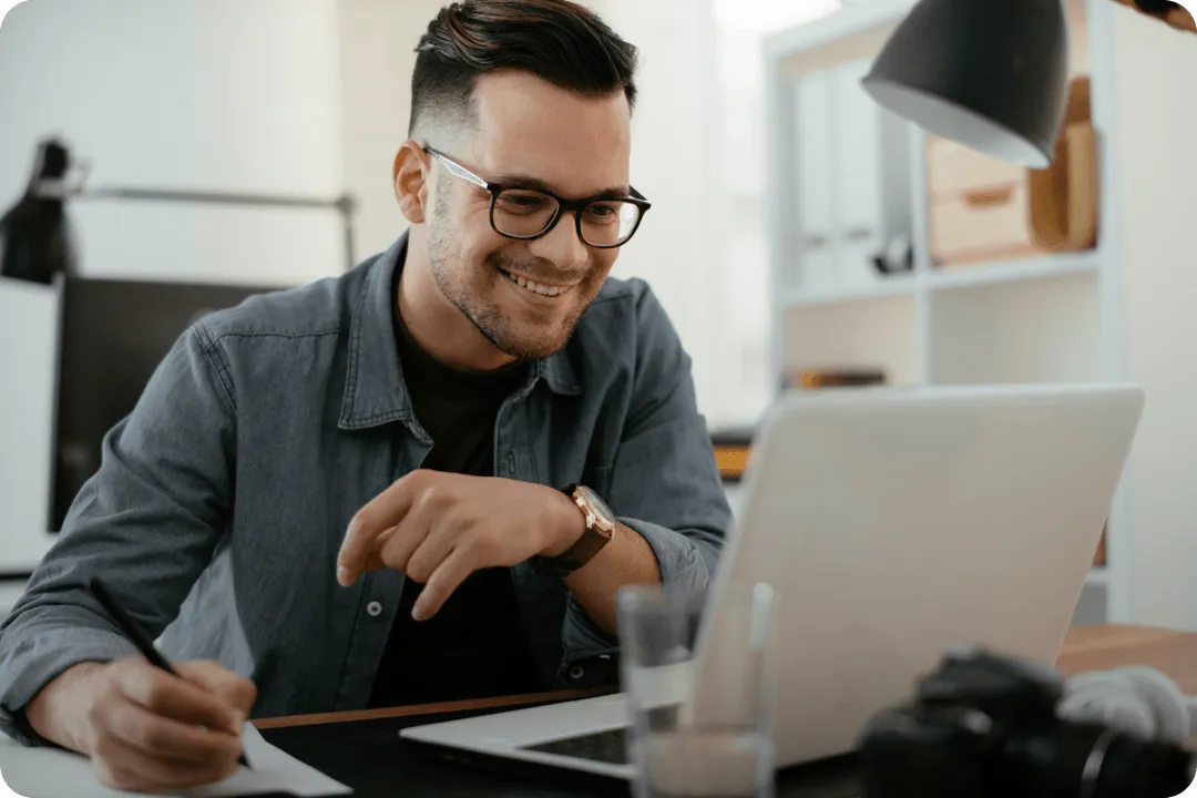 Person sitting at the table with a laptop.