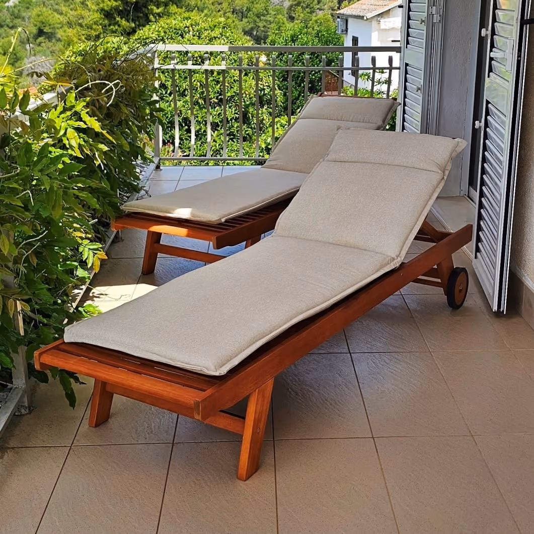 Villa Perla sun loungers on a balcony surrounded by Mediterranean greenery in Okrug Gornji