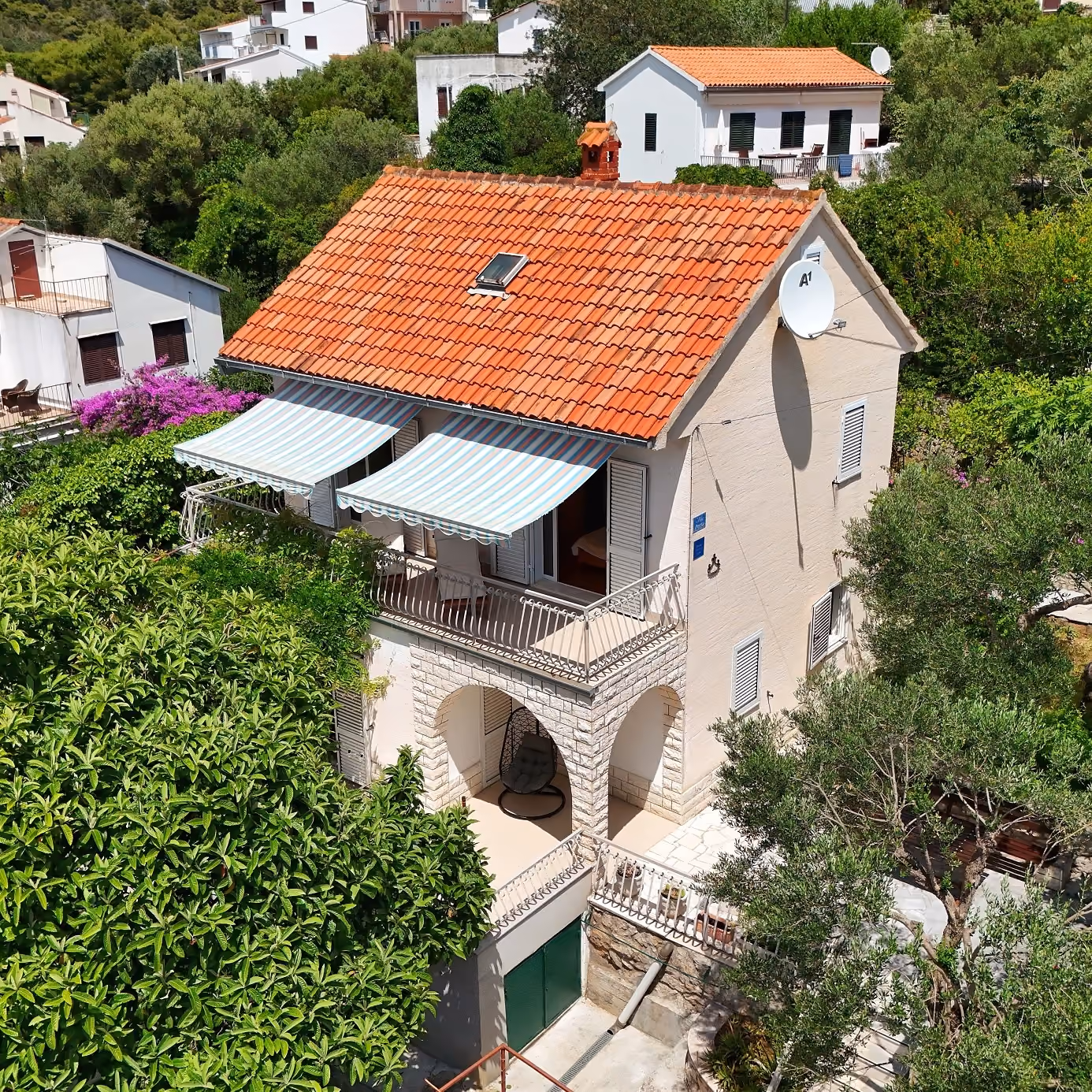 Villa Perla seaside holiday villa in Okrug Gornji near Trogir surrounded by Mediterranean greenery