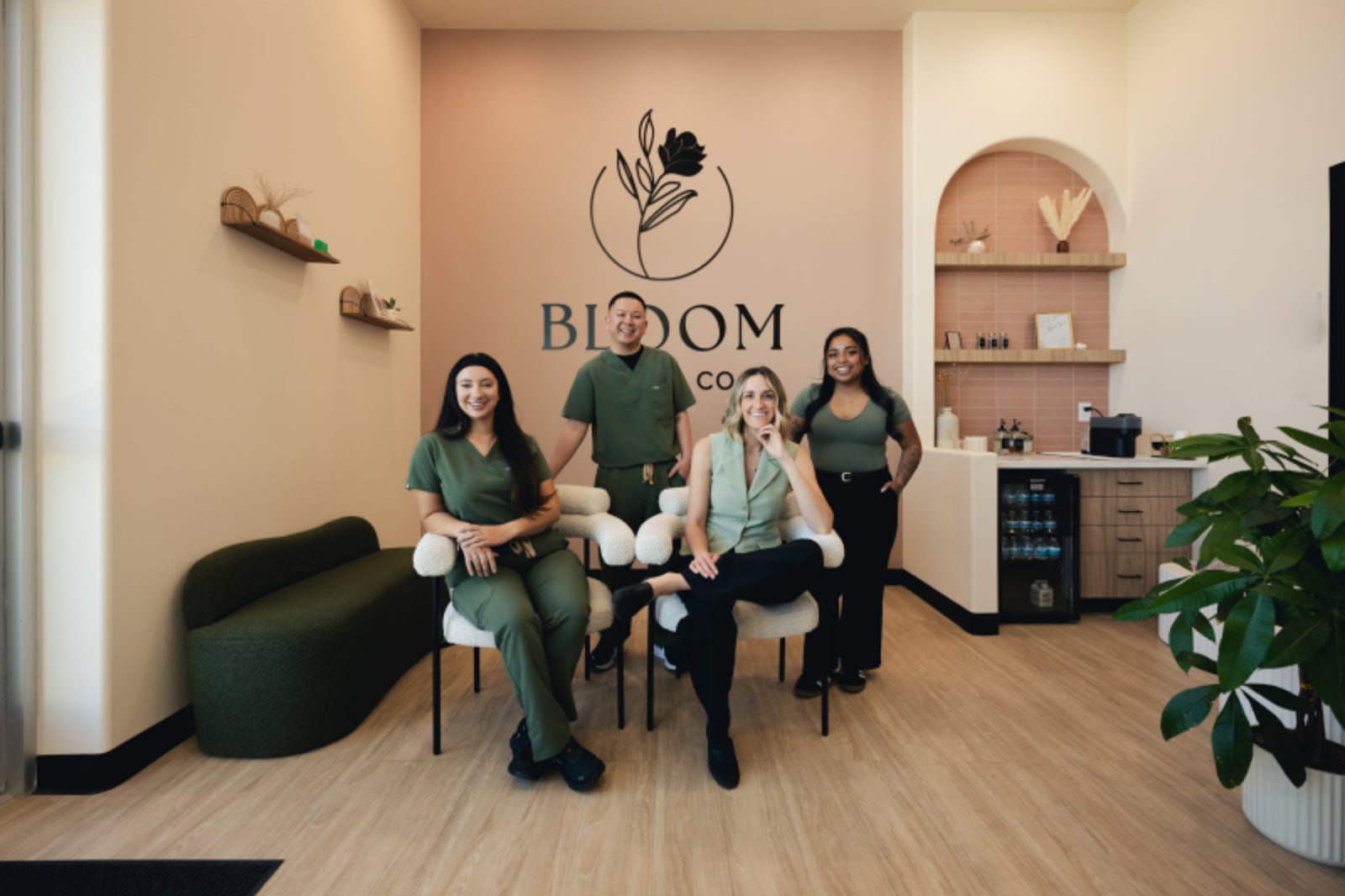 Bloom Dental Co team members standing together in modern office space