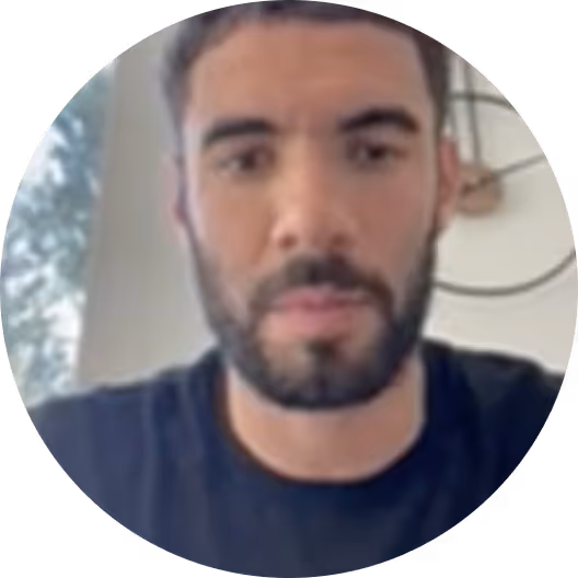 Profile photo of a person with beard wearing a dark blue shirt