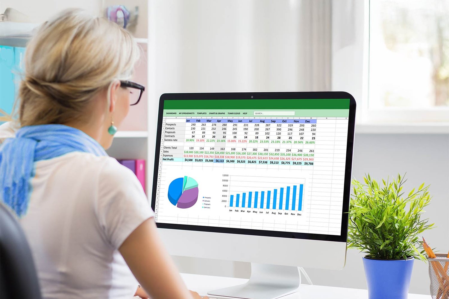 A finance team member working through check-in data in a spreadsheet