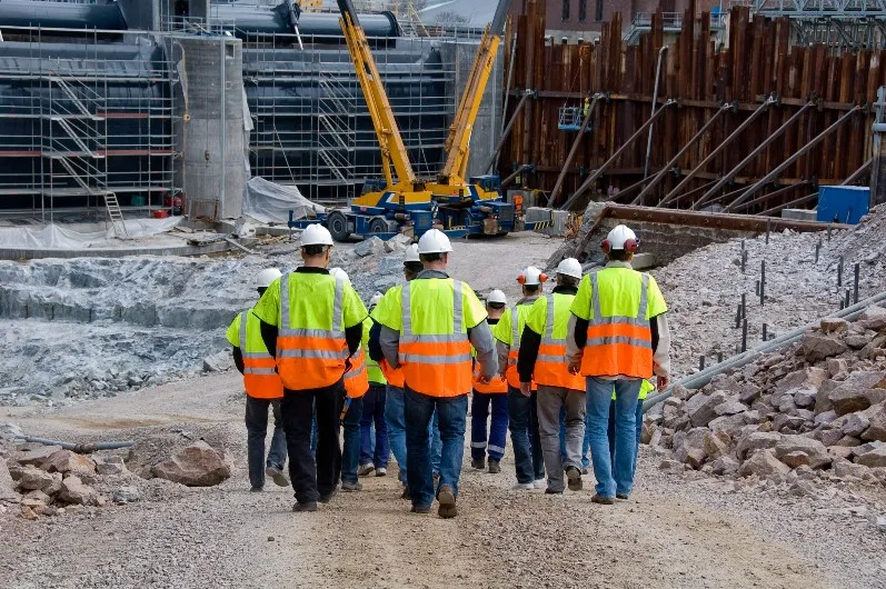 Construction site show everyone walking in the same direction