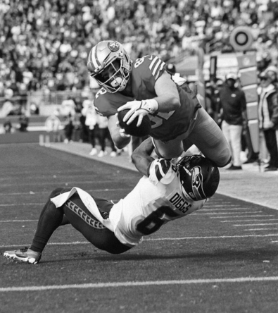 High-intensity football moment showing explosive athleticism – representing the next-level potential we help athletes unlock at Red Envelope.