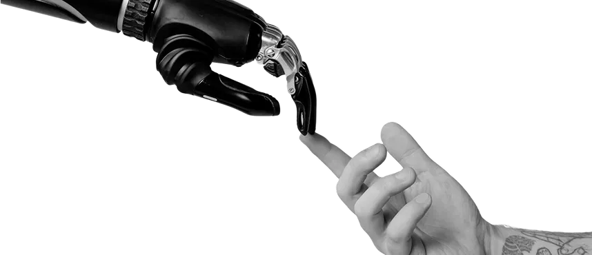 Human hand reaching out to touch robotic hand