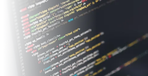 Color-coded software code on screen, representing development work