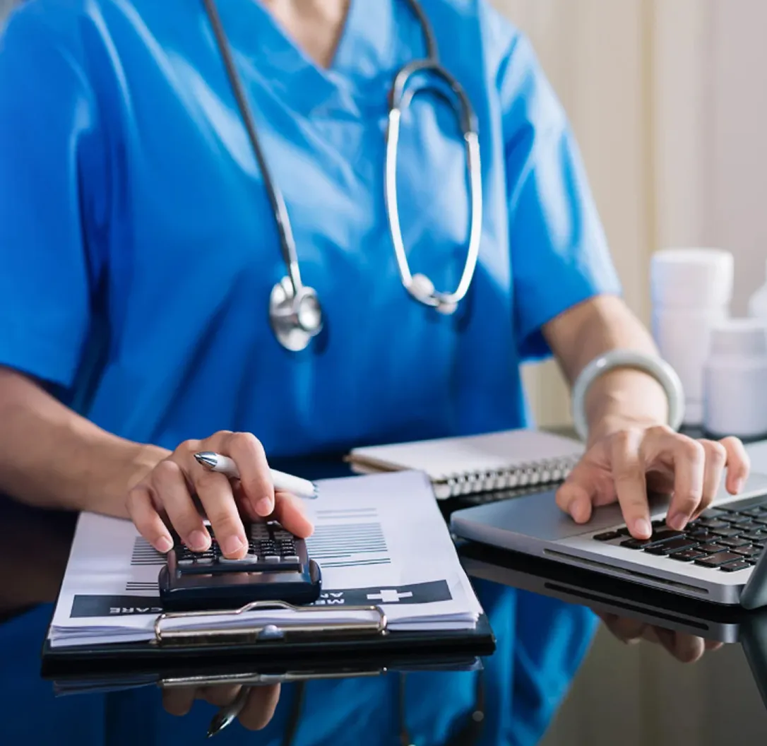 Healthcare professional using laptop with focus on cybersecurity