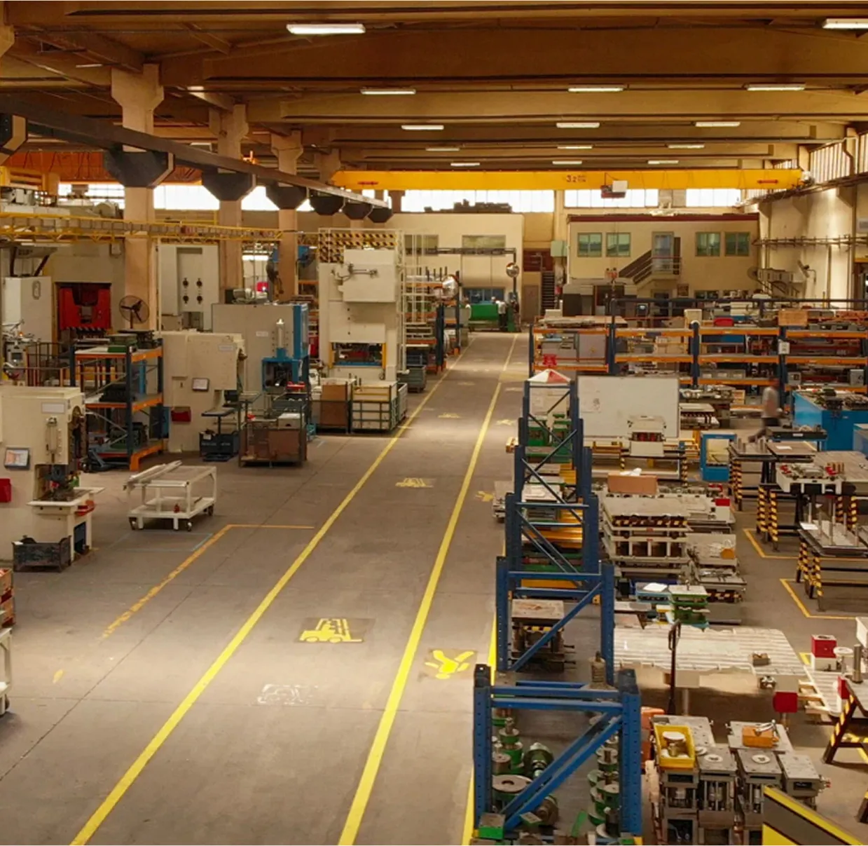 Wide shot of an organized factory floor with industrial equipment
