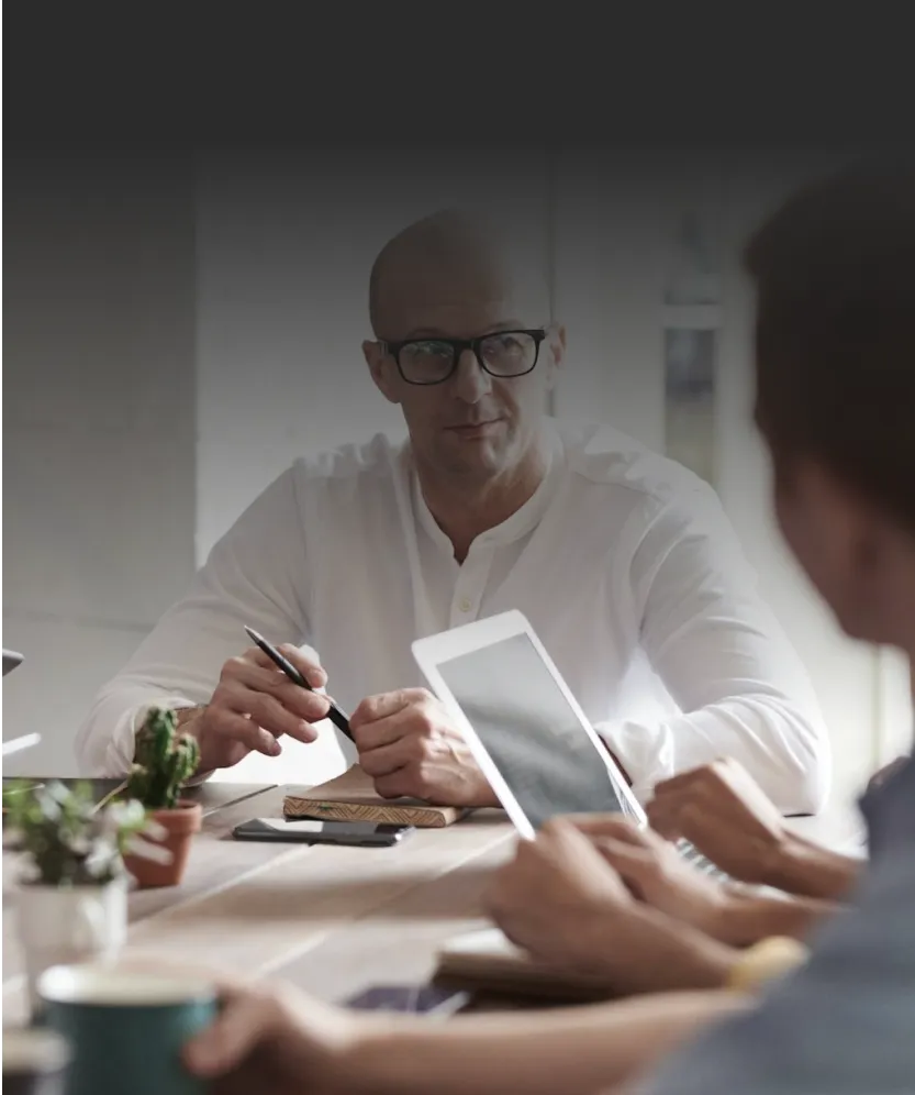 Professional team in meeting, reviewing documents together