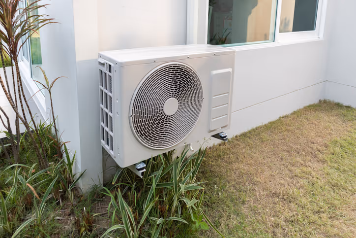Sunshine Services installed outdoor split AC condenser unit for residential cooling in Florida