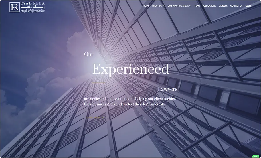 View looking up at a modern glass office building with text overlay about experienced lawyers and legal services on a blue sky background.