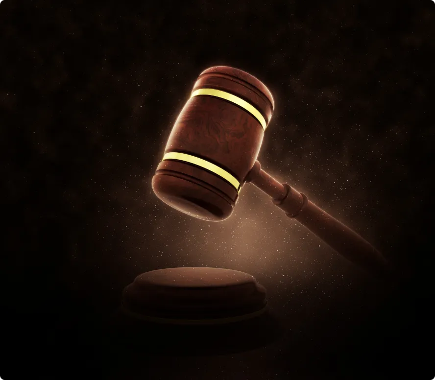 Wooden judge's gavel with glowing yellow bands hovering above a sound block against a dark background.