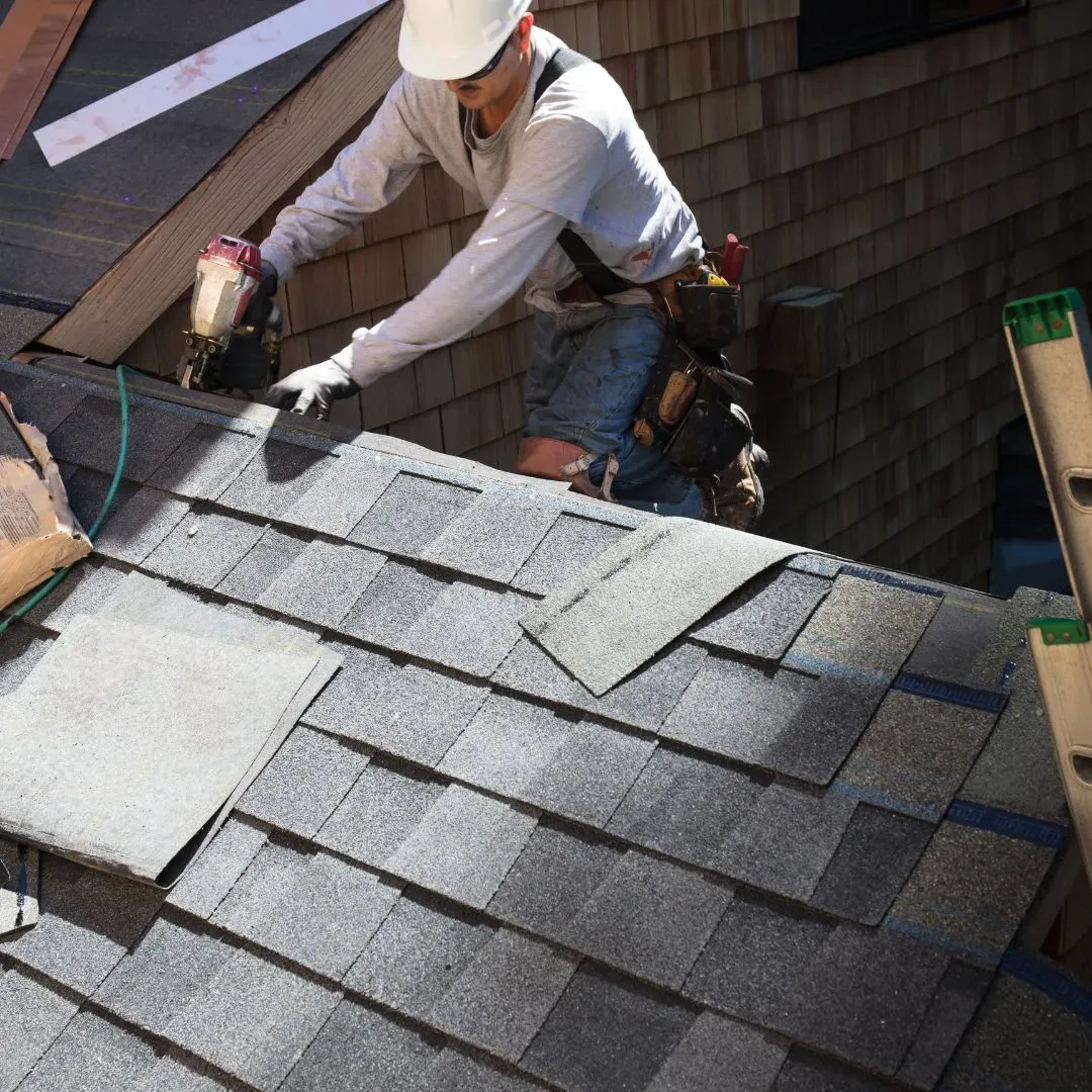 real roofer performing roof repairs