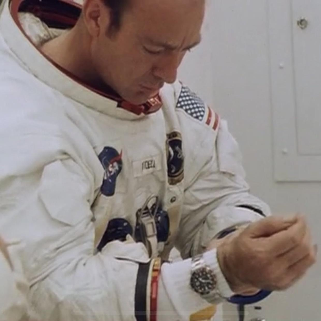 Edgar Mitchell using a Rolex watch in space