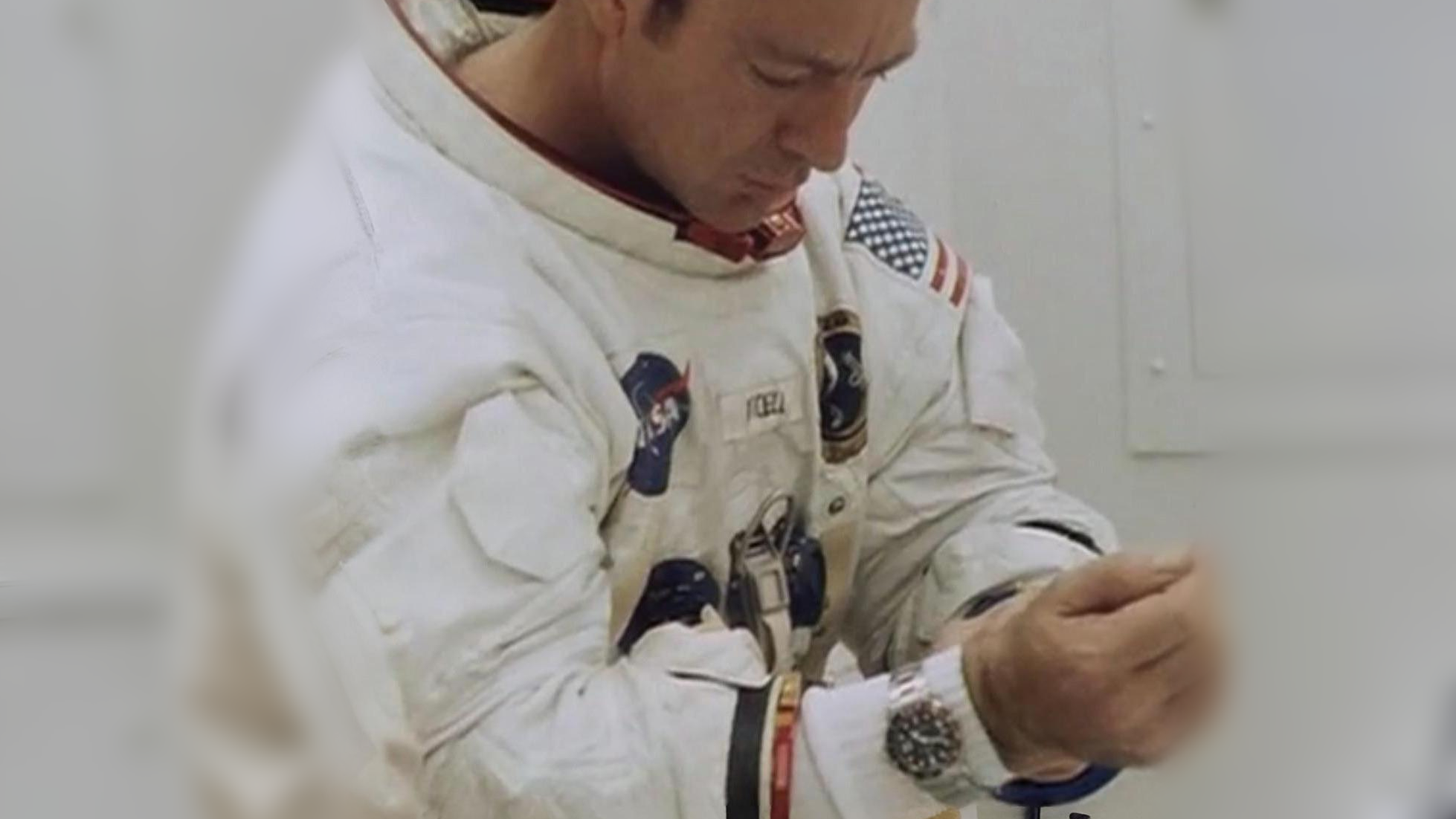 Edgar Mitchell using a Rolex watch in space