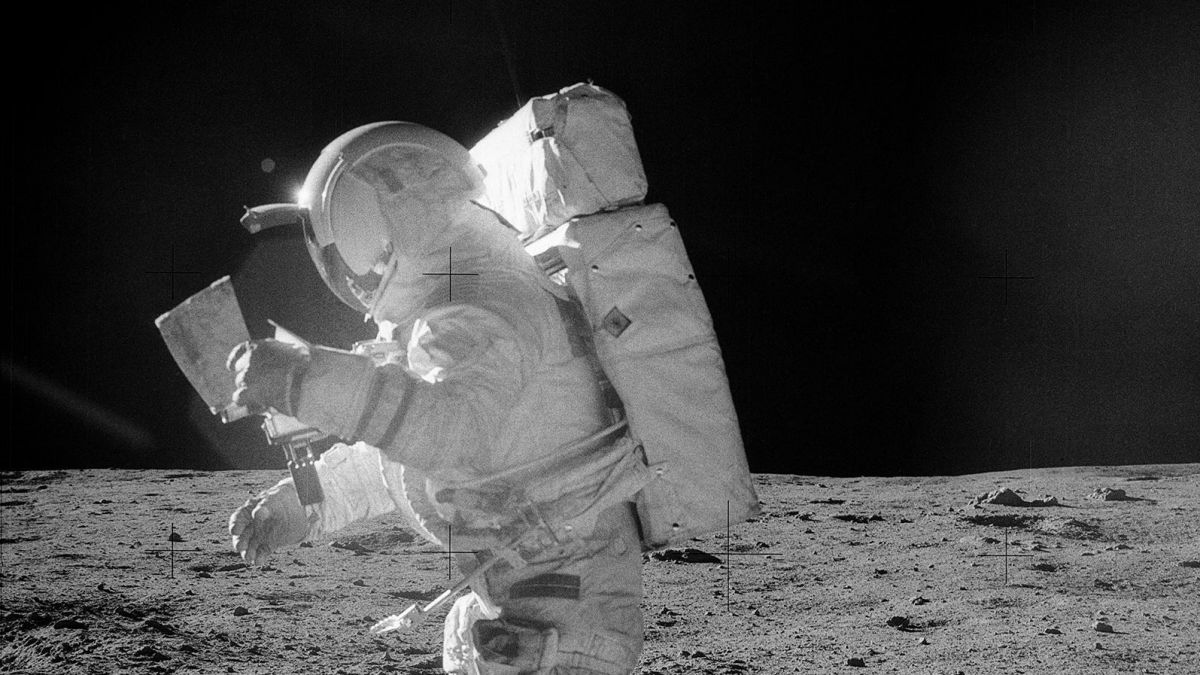 Edgar Mitchell using a Omega watch in space