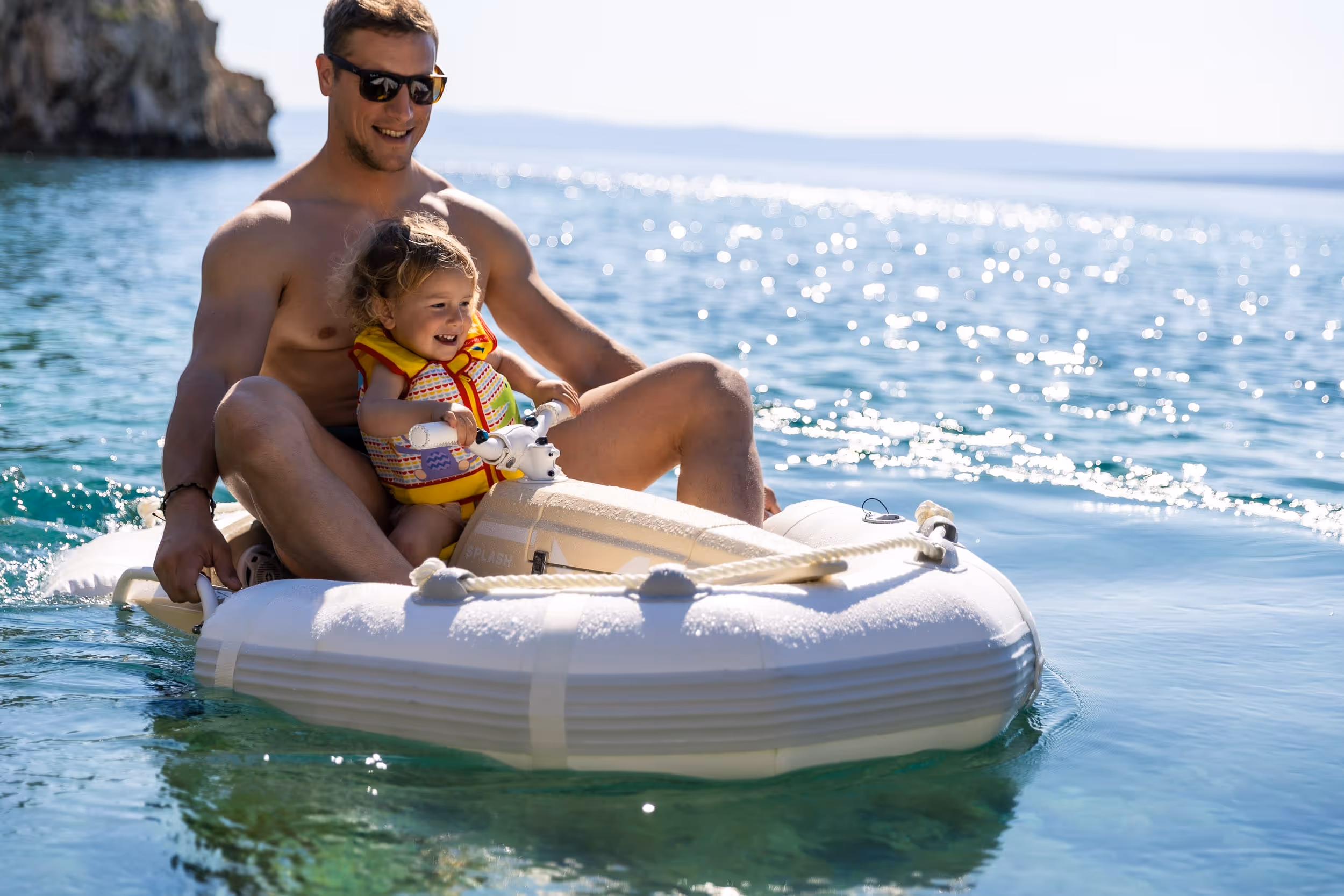 Father and daugher in a Darth Craft watercraft smiling