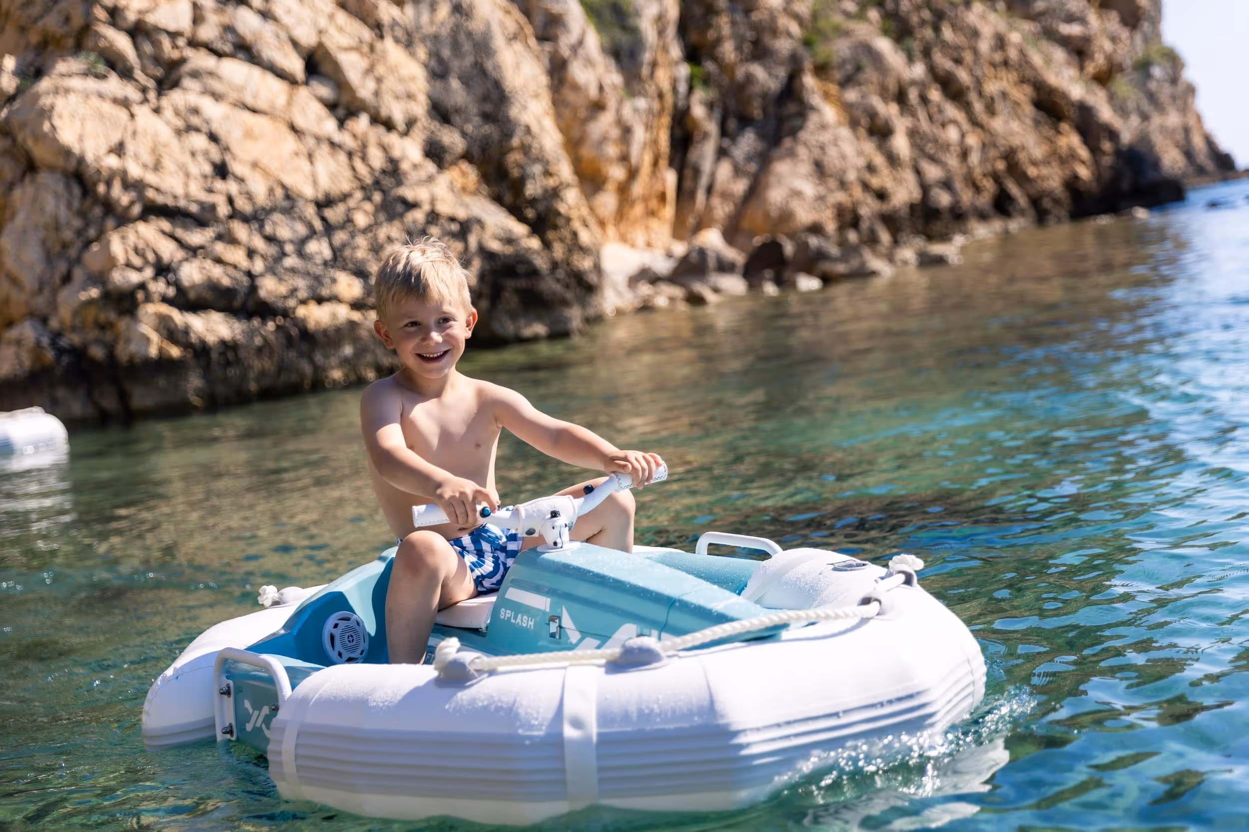 A male kid on a Darth Craft watercraft