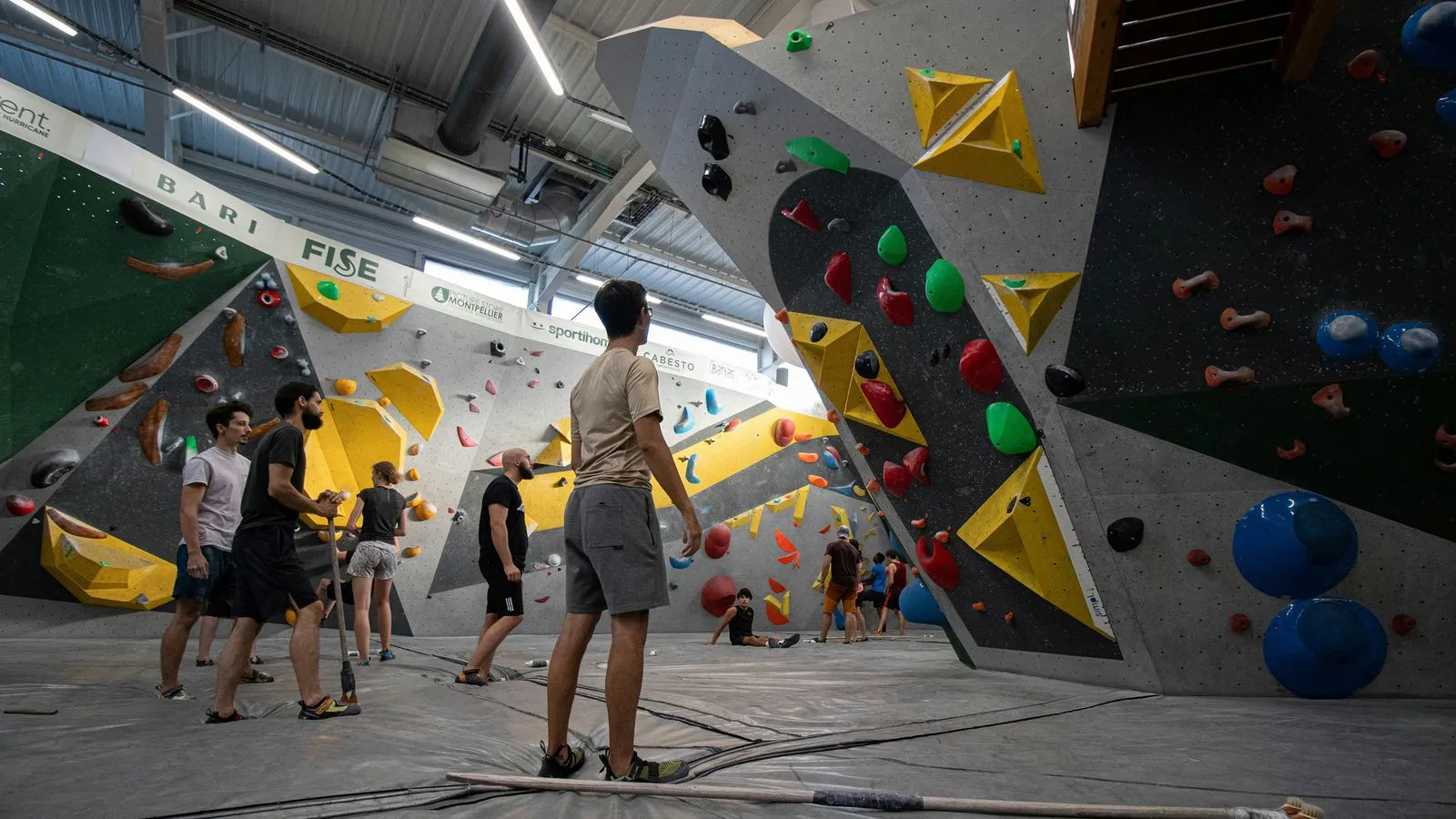 Climbers at rock climbing wall event
