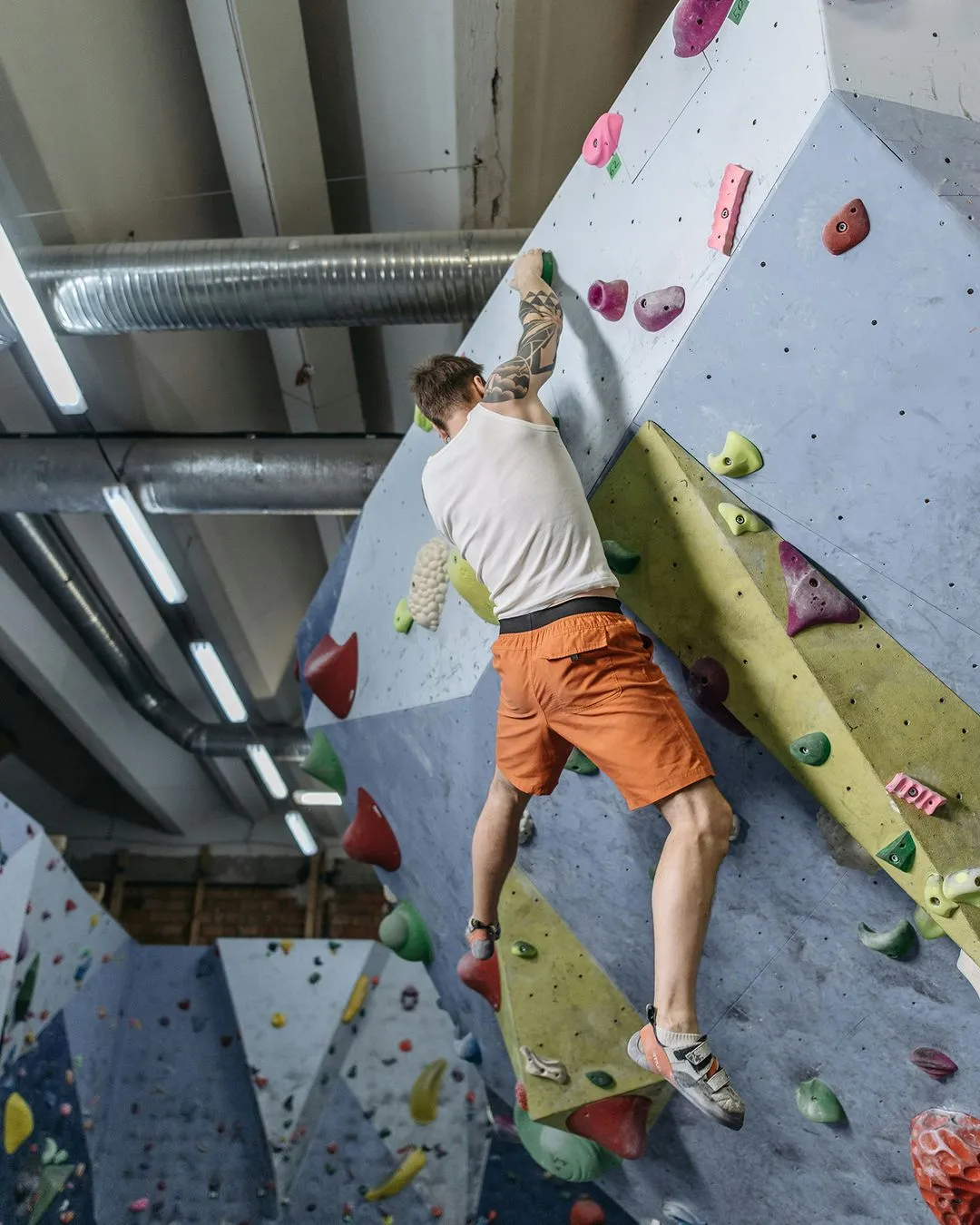 Climber hanging on wall