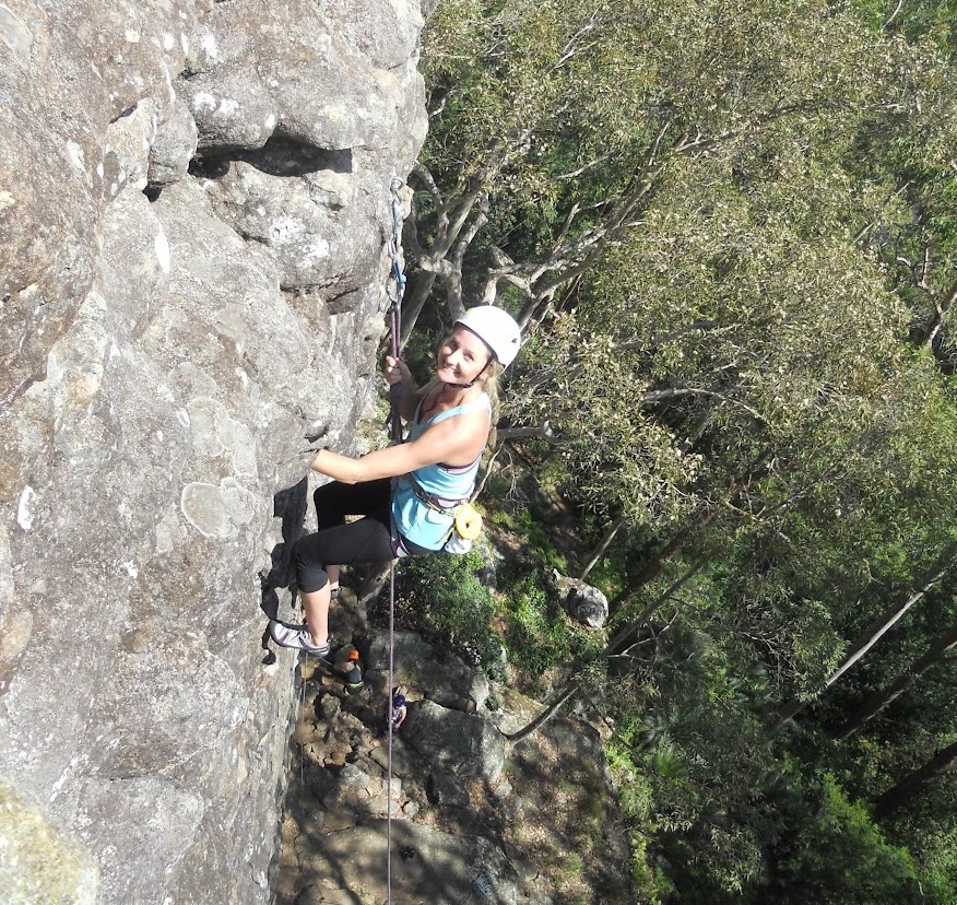 Climber smiling on real rock at Thompson's Point, Nowra — Hangdog Outdoor Climbing Day
