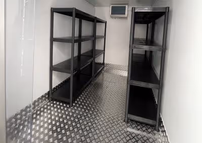 A room that has some shelves in it.