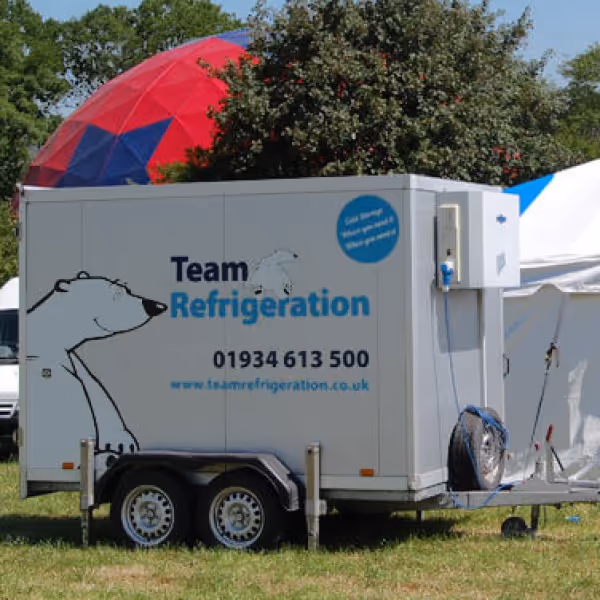 A trailer with a tent in the back of it.