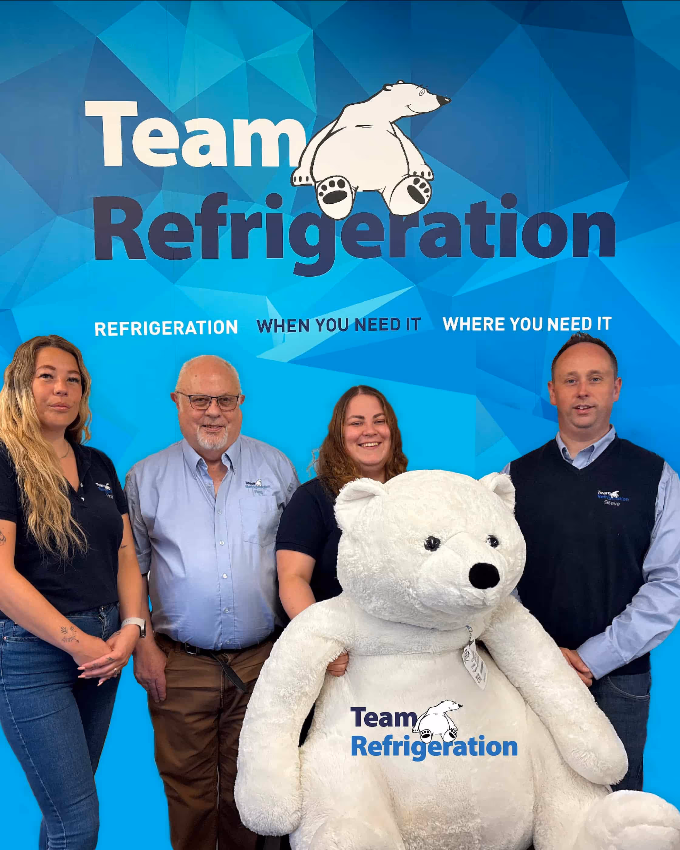 team refrigeration team photo with blue background holding polar bear