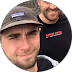 profile of two males in a circle