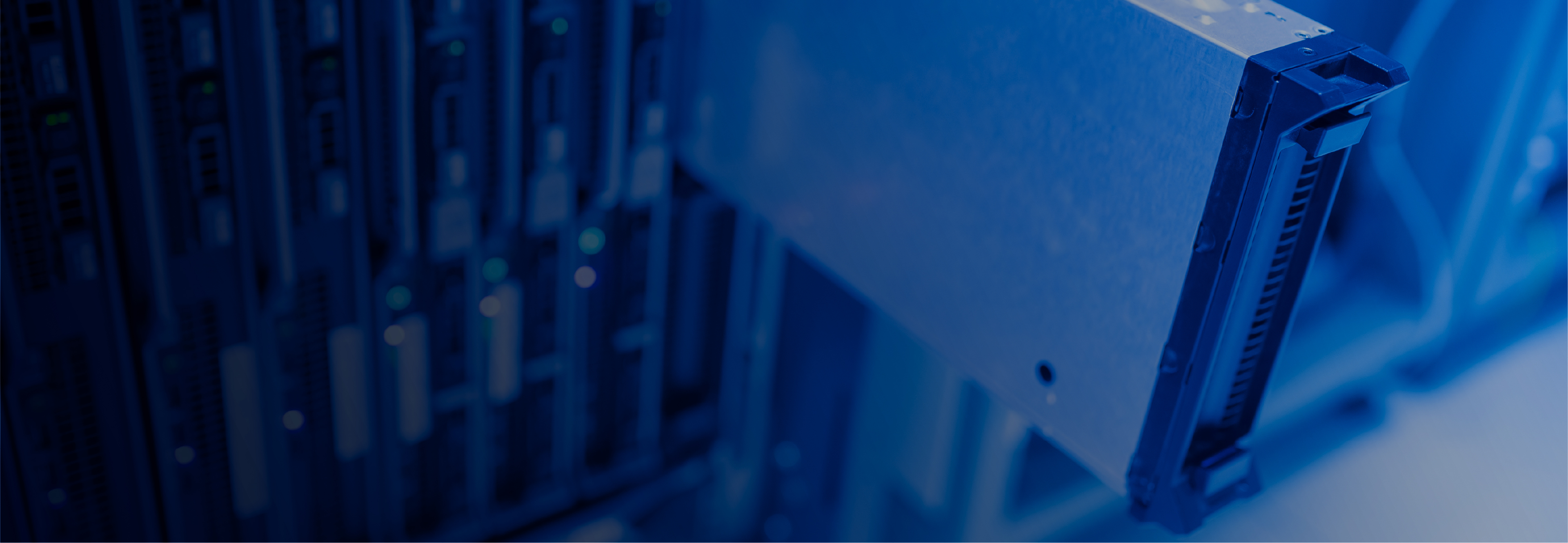 Close-up of a computer server connector with blurred server racks in the background.