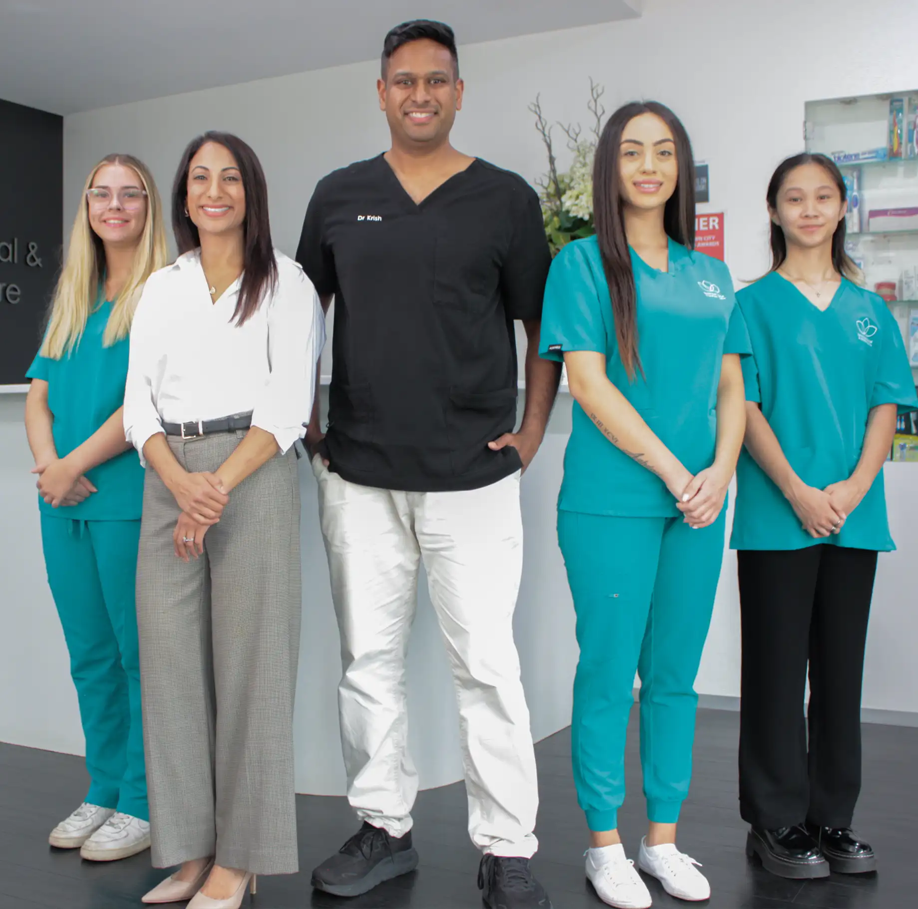 Northwest Dental and Implant centre team standing in practice together. 