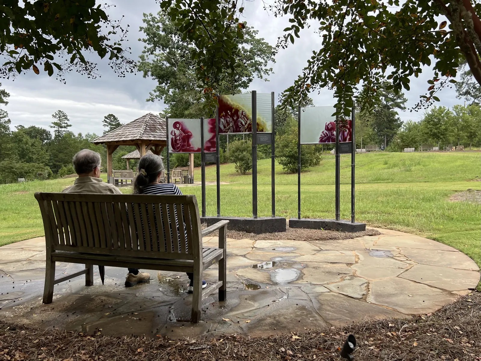 couple sitting on a bench at heritage retreat GA