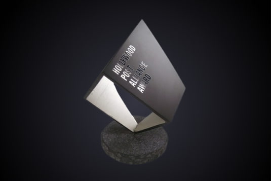 The angular HPA Engineering Excellence Award trophy on a stone base