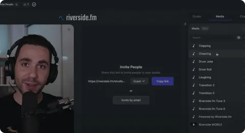 Man speaking into a microphone with headphones in the Riverside.fm interface showing media options like Clapping and Laughing.