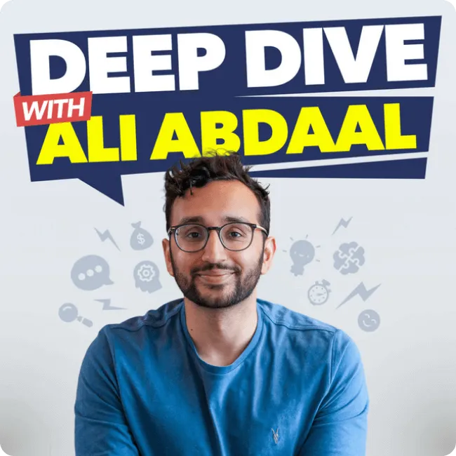 Man with glasses and beard smiling, wearing a blue shirt, under text saying 'Deep Dive with Ali Abdaal.'