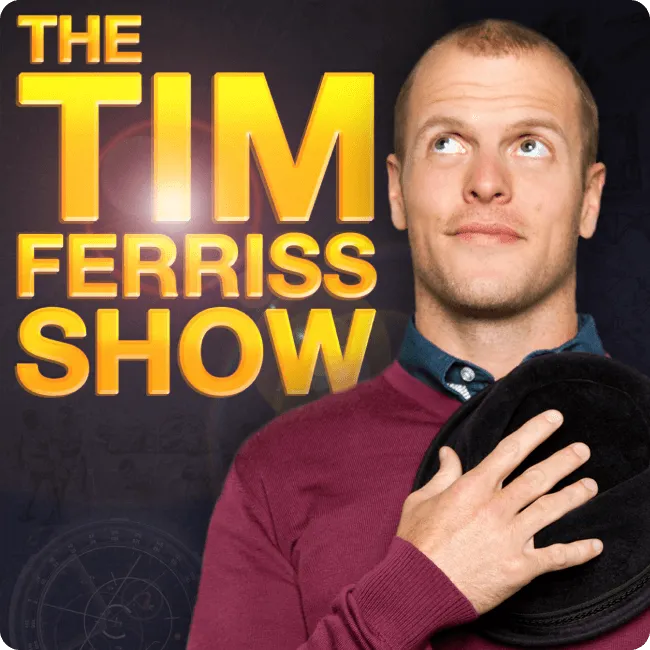 Portrait of a man in a maroon sweater holding a black hat and looking upward beside bold yellow text 'THE TIM FERRISS SHOW' on a dark background.