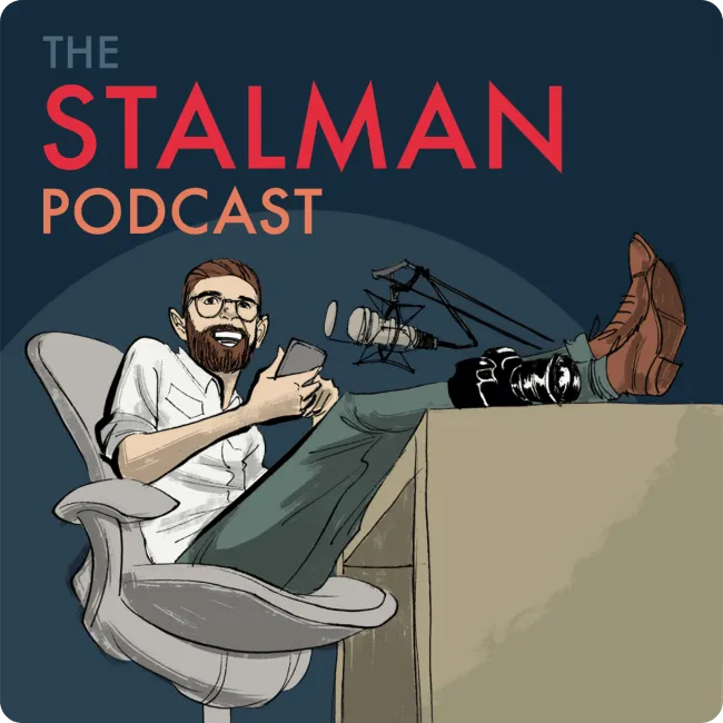 Illustration of a man with glasses and beard reclining in a chair with feet on a desk, smiling and holding a phone next to a microphone, titled The Stalman Podcast.