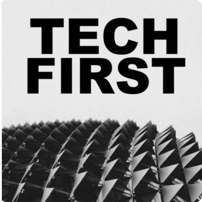 Bold black text reading 'TECH FIRST' above a close-up of a geometric, spiked architectural structure in grayscale.