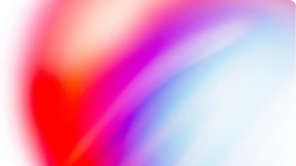 Abstract gradient background blending soft red, pink, purple, and blue colors.