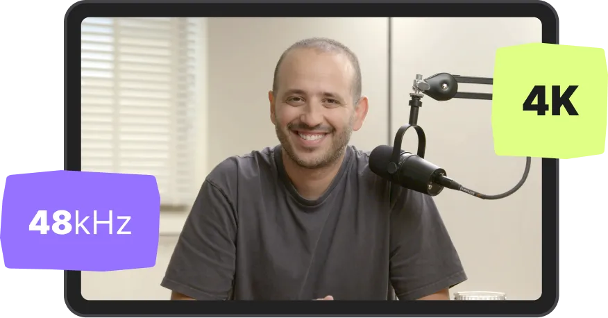 Smiling man sitting behind a microphone with '48 kHz' and '4K' text overlays.
