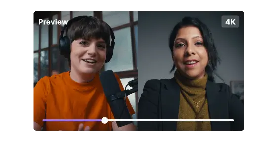 Split-screen video of a smiling woman in an orange shirt with headphones and a microphone on the left, and a woman in a black blazer and brown turtleneck on the right.