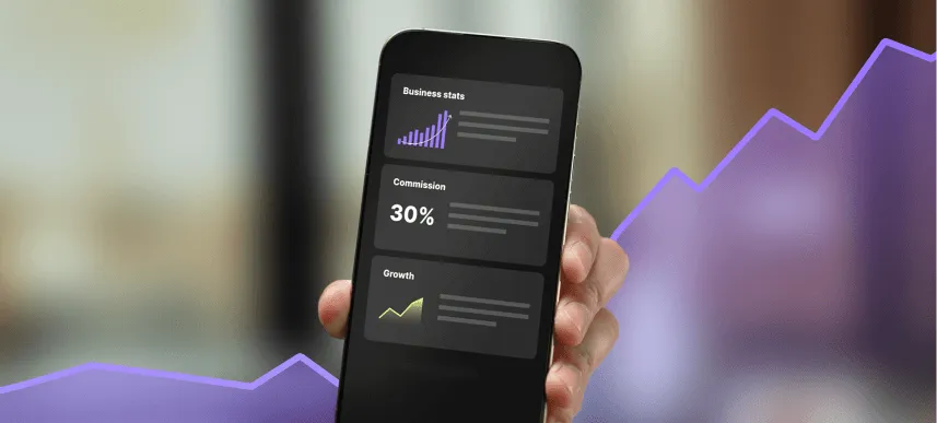 Hand holding smartphone displaying business stats, 30% commission, and growth graphs with purple and yellow lines.