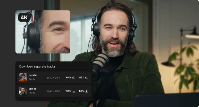 Man with long hair and beard wearing headphones and speaking into a microphone during a recording session.