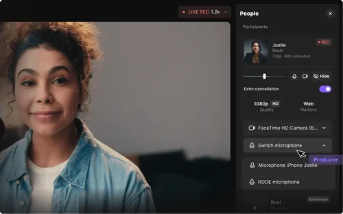 Young woman with curly hair smiling during a live video call with microphone and camera controls visible on screen.