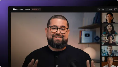 Man with glasses and beard speaking on a Riverside video webinar with five participants visible in sidebar.