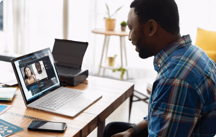 Man smiling while video chatting