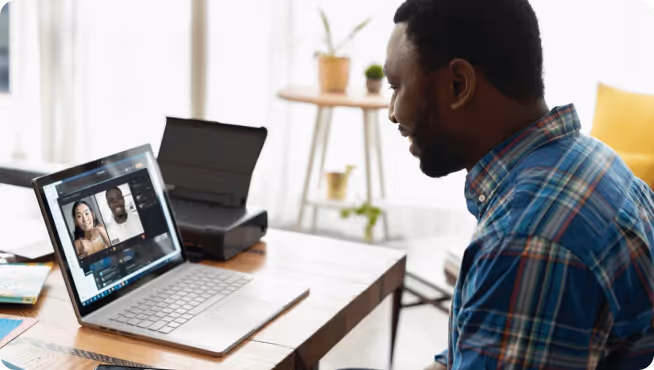 video chatting on a laptop with two people