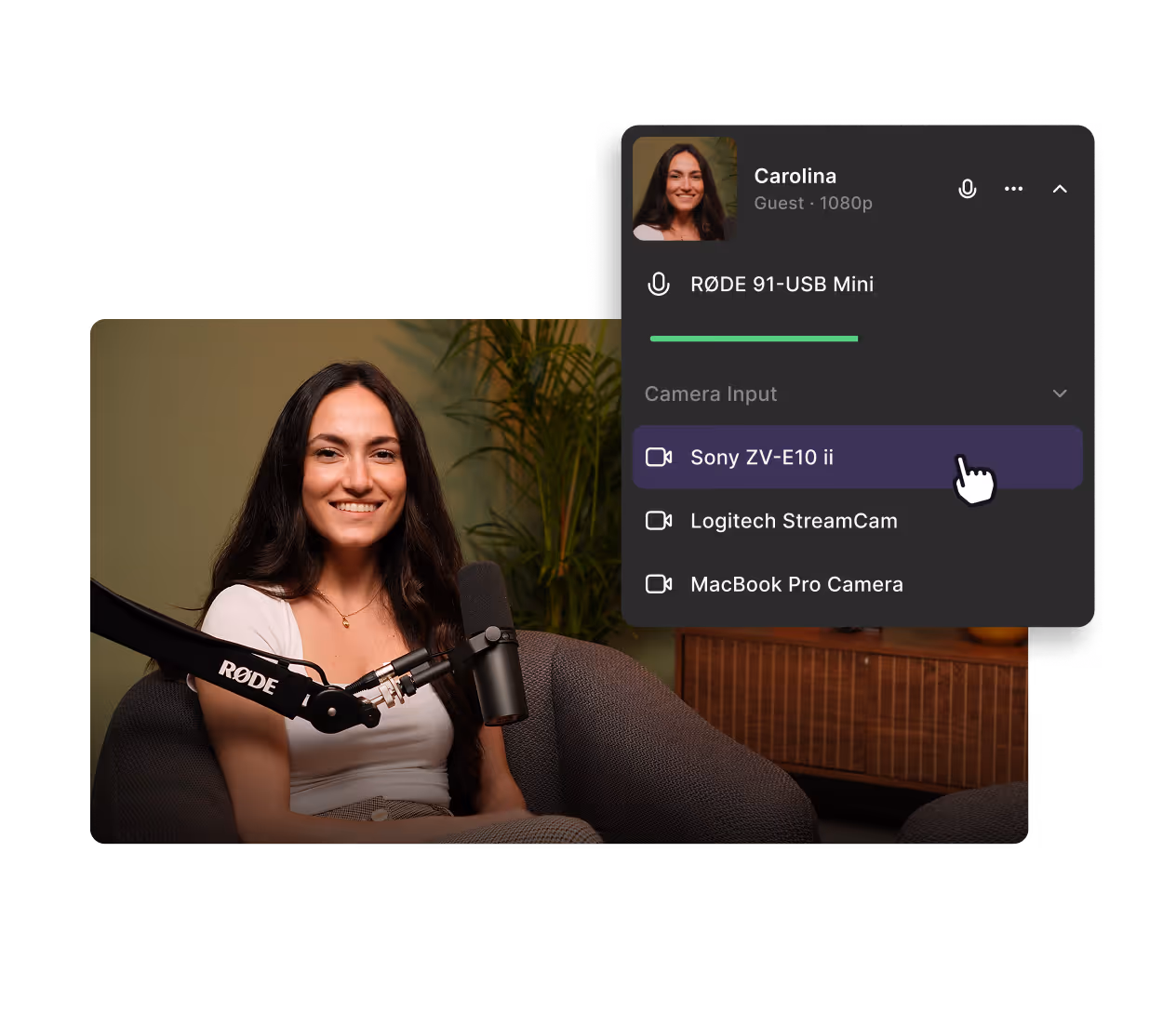 Smiling woman seated and camera input menu on screen.