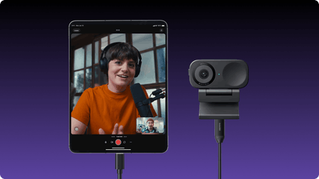 Picture of a woman and a recording camera facing the site visitor
