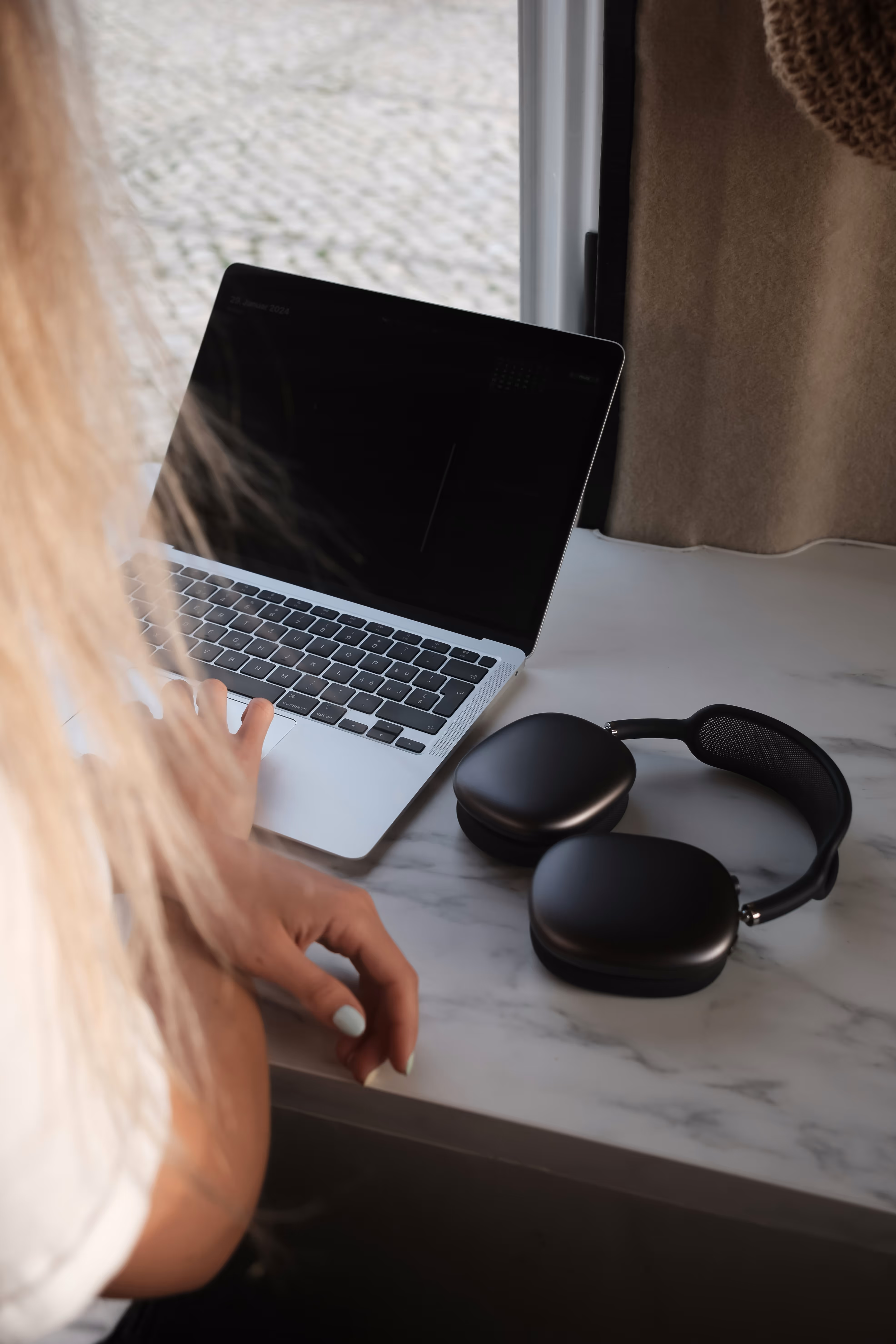 A macbook and headphones
